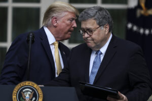 A photo of former President Donald Trump whispering something to former Attorney General Bill Barr.