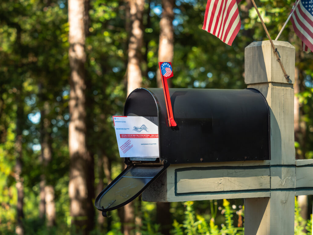 Photo of an absentee ballot in a mail-box. Atlanta, GA- SEPTEMBER 30, 2020 (Adobe Stock) 