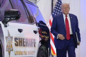 Republican presidential nominee former President Donald Trump arrives to speak on crime and safety during a campaign event at the Livingston County Sheriff's Office, Tuesday, Aug. 20, 2024, in Howell, Mich. (AP Photo/Evan Vucci)