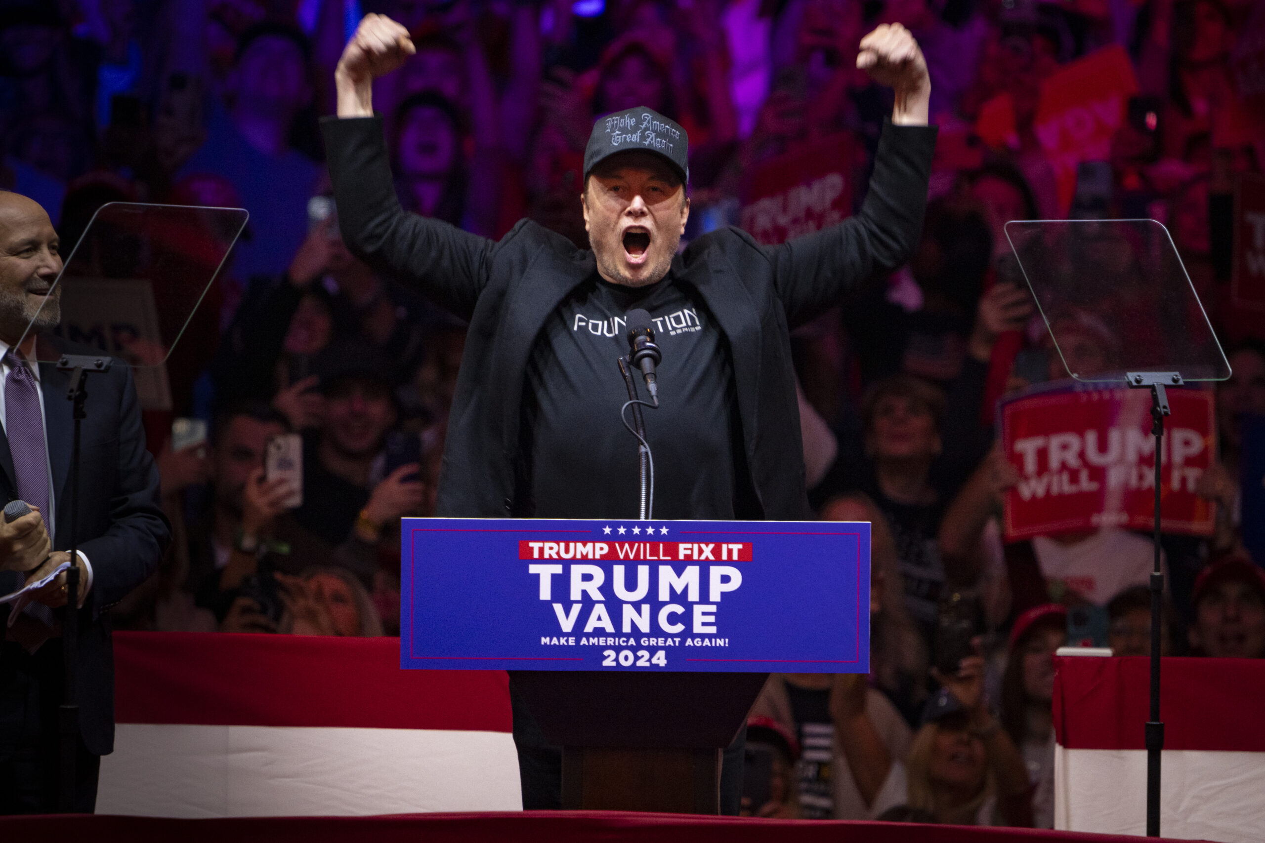 Entrepreneur Elon Musk cheers for former president Donald J. Trump at Trump's rally at Madison Square Garden in New York on Sunday, Oct. 27, 2024. (Angelina Katsanis/POLITICO via AP Images)